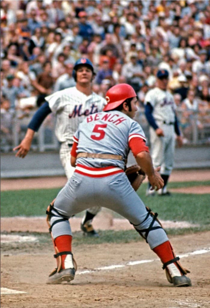 Catcher in ready stance behind home plate